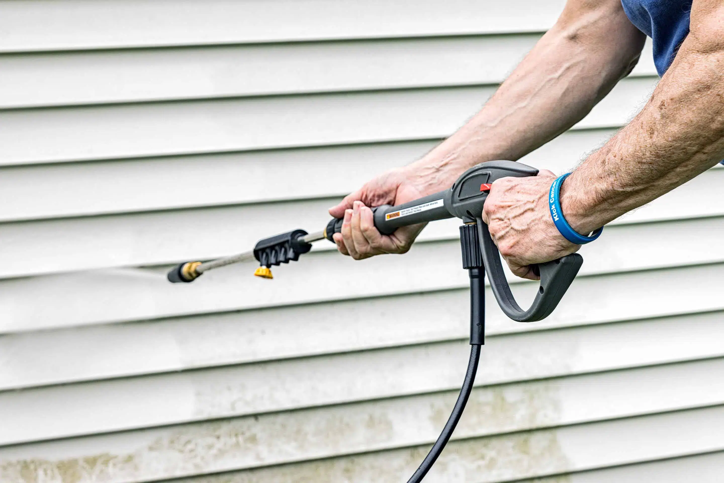 Robinson Painting crew performing pressure wash prep on exterior home in Boulder, Colorado